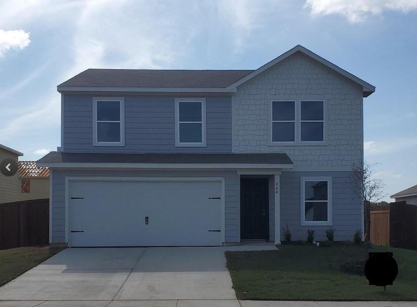 View of property with a garage