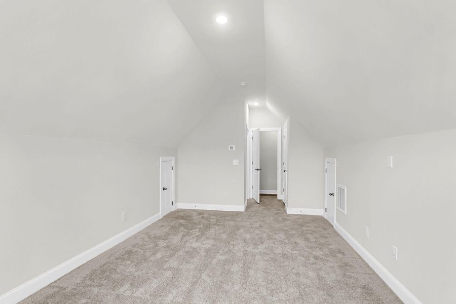 Spacious, unfurnished interior of a new home in Tidewater at Lakes of Cane Bay, Summerville (Image 32).