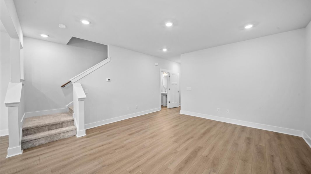 Vibrant and welcoming family room anchored by clean linesand abundant light at Saluda Crossing in Piedmont, SC