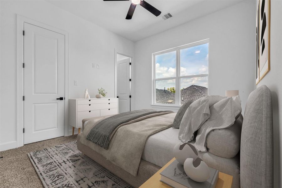A charming secondary bedroom on the third floor, featuring plush carpeting, abundant natural light, and serene views. (Virtually Staged) A charming secondary bedroom on the third floor, featuring plush carpeting, abundant natural light, and serene views. (Virtually Staged)