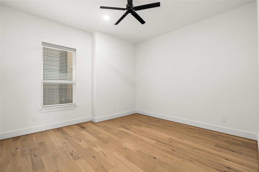 Spacious secondary bedroom on the second floor, perfect for use as a guest room, home office, or flex space to suit your lifestyle needs.