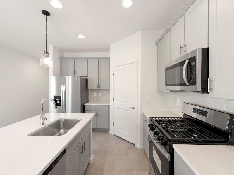 Front exterior of a new home in Hanson Ridge, Vail, AZ, highlighting curb appeal (Image 1).