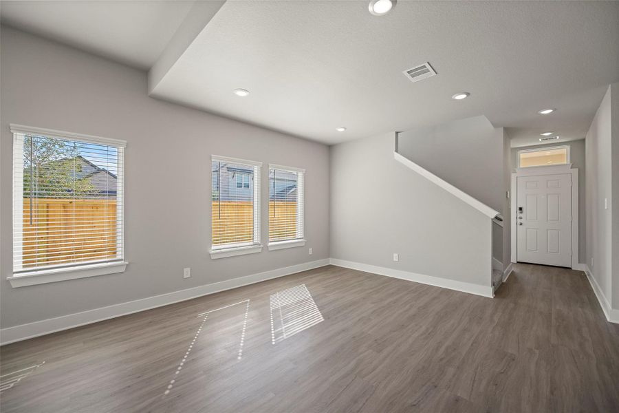 Large windows fill the space with light while the neutral tones make decorating effortless.