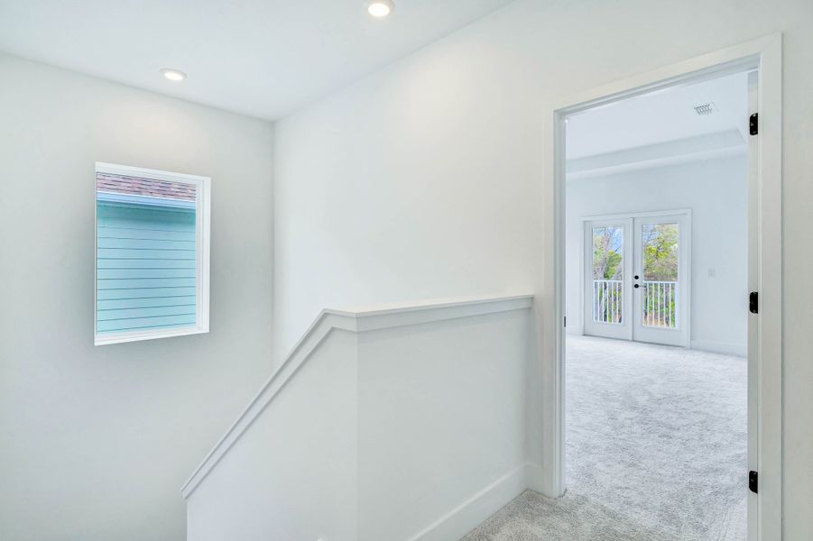 Representative unfurnished interior of a home built from the Faulkner by Rockwell Homes in Northlake At Ovation, Winter Garden (Image 18).