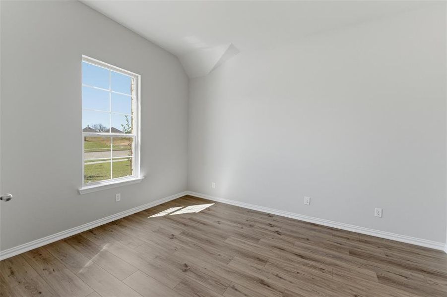 Empty room featuring light wood-style floors and baseboards