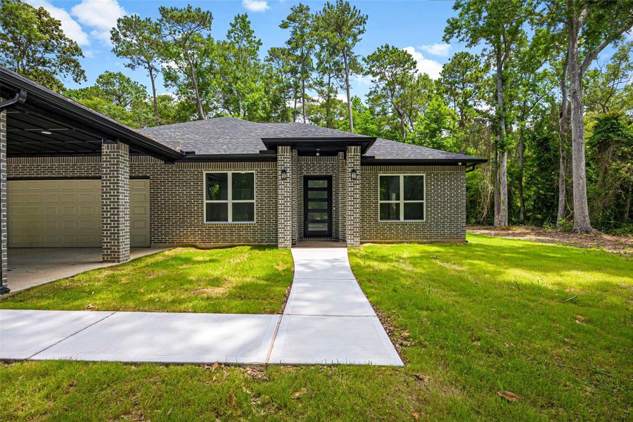 Exterior details and patio area of a home in , Splendora (Image 31).