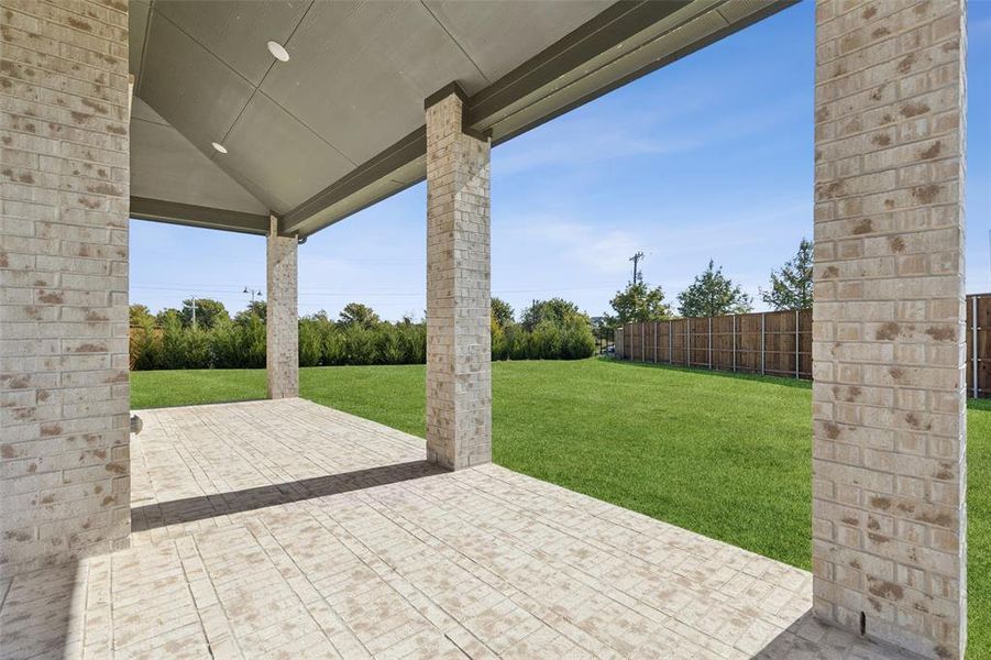 Exterior details and patio area of a home in Cambridge Estates, Prosper (Image 26). Exterior details and patio area of a home in Cambridge Estates, Prosper (Image 26).