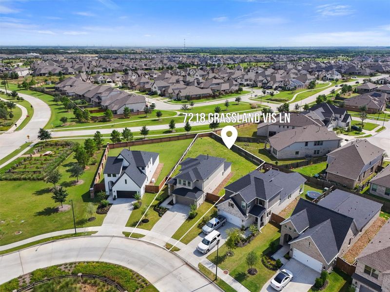 This wide aerial shot places the home in the context of the larger Elyson community, showcasing its proximity to walking paths and other open spaces. The photo reinforces that this home is part of a vibrant, master-planned community designed for an active and social lifestyle.