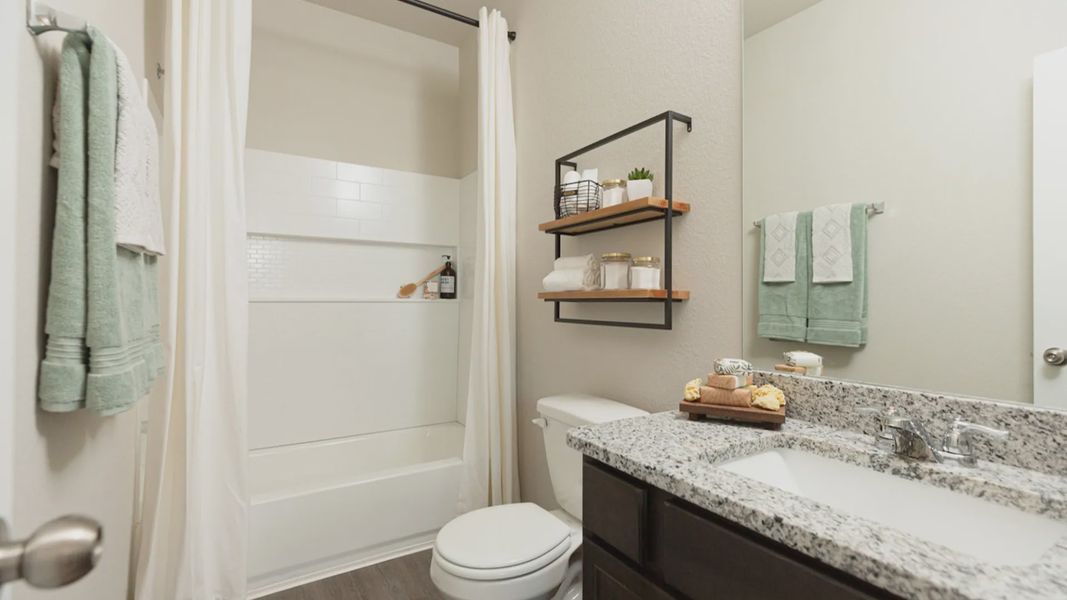Representative furnished interior of a home built from the The Woodland by Legend Homes in Granger Pines, Conroe (Image 10).