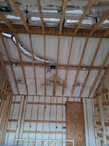 Attic with blown in foam insulation 2x8 joists
