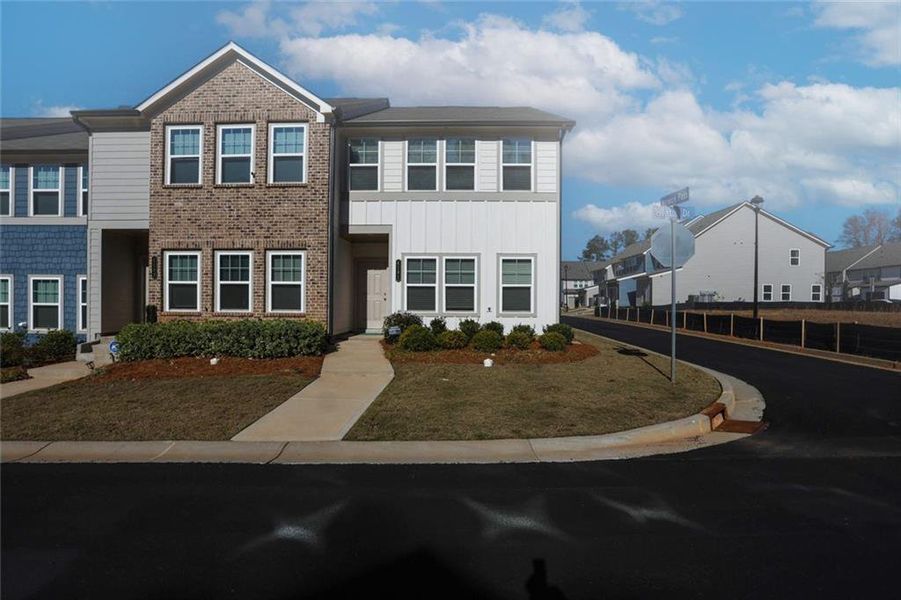 Front exterior of a new home in Laurelwood, Douglasville, GA, highlighting curb appeal (Image 30).