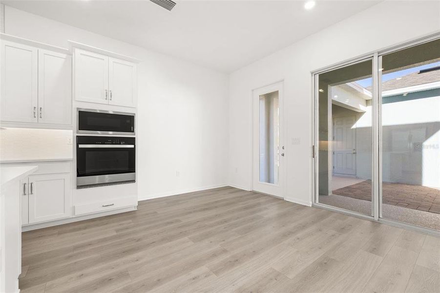 Spacious, unfurnished interior of a new home in Serenade at Ovation, Winter Garden (Image 20).