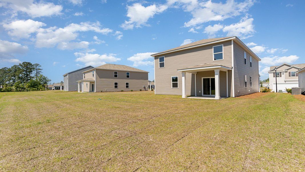 Representative exterior photo of a completed home built from the ROBIE by D.R. Horton in Sandridge Park, Little River, SC (Image 16).