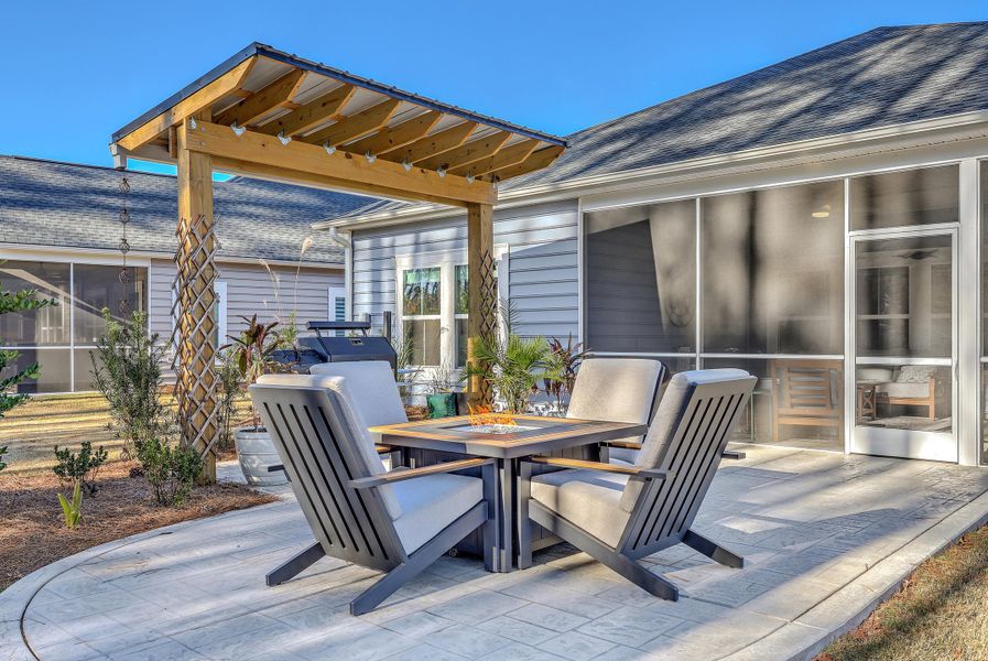 Exterior details and patio area of a home in Horizons at Summers Corner | 55+: The Legends, Summerville (Image 24).