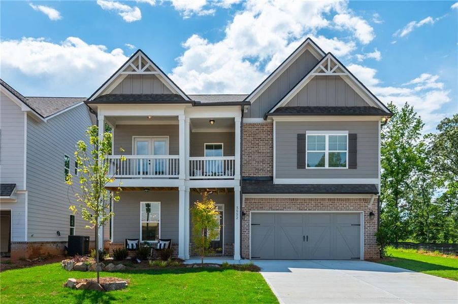 Front exterior of a new home in , Flowery Branch, GA, highlighting curb appeal (Image 1). Front exterior of a new home in , Flowery Branch, GA, highlighting curb appeal (Image 1).