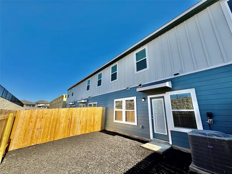 Back of property with board and batten siding