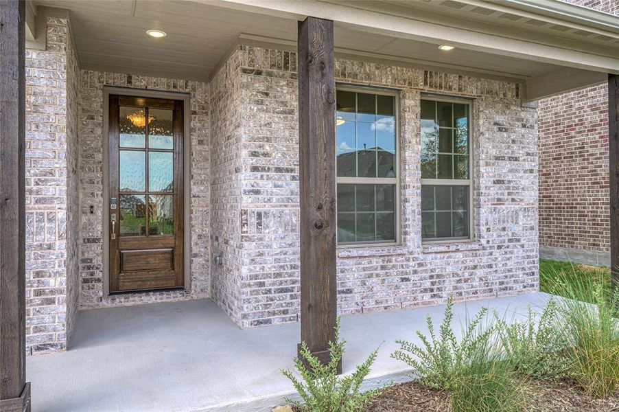 Entrance to property with brick siding and covered porch Entrance to property with brick siding and covered porch