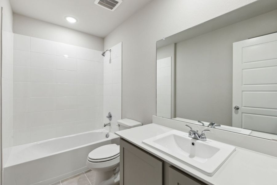 Bathroom in the Harrison home plan by Trophy Signature Homes – REPRESENTATIVE PHOTO Bathroom in the Harrison home plan by Trophy Signature Homes – REPRESENTATIVE PHOTO