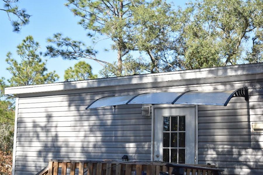 Exterior details and patio area of a home in , Williston (Image 35).