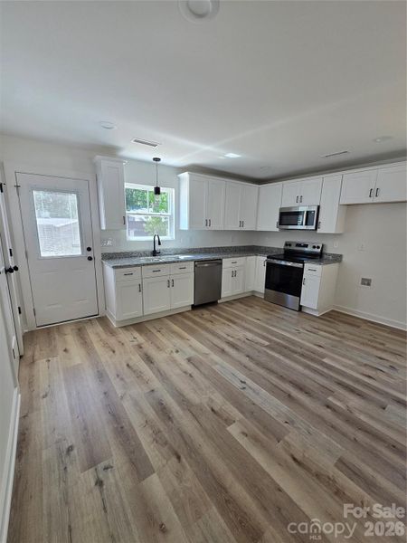 Spacious, unfurnished interior of a new home in , New London (Image 9).