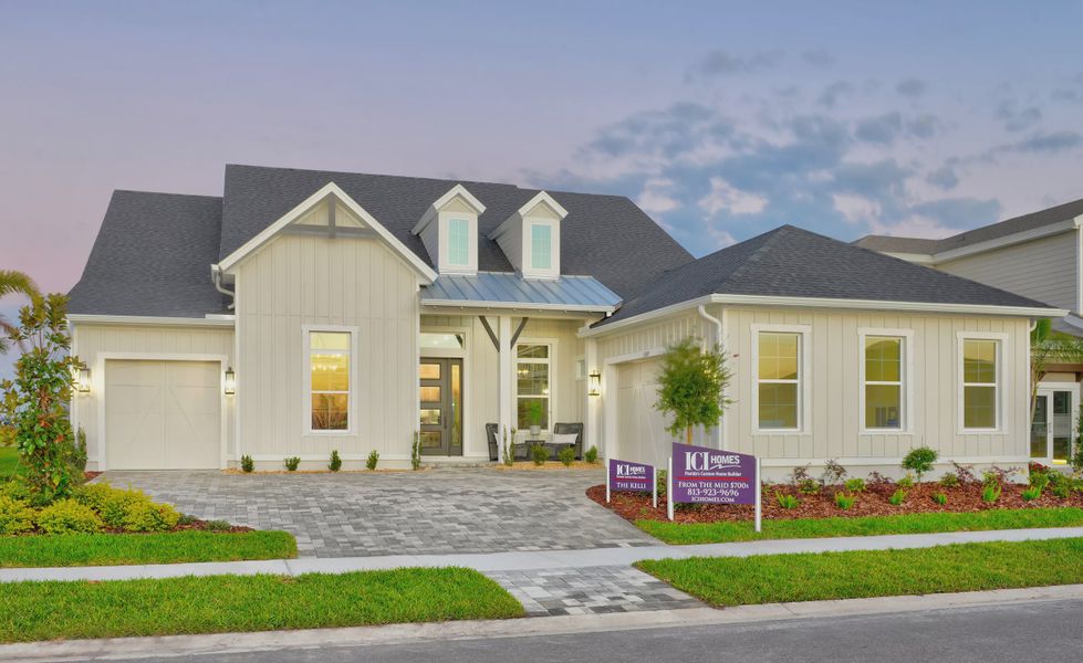 Front exterior of a new home in Waterset, Apollo Beach, FL, highlighting curb appeal (Image 1).