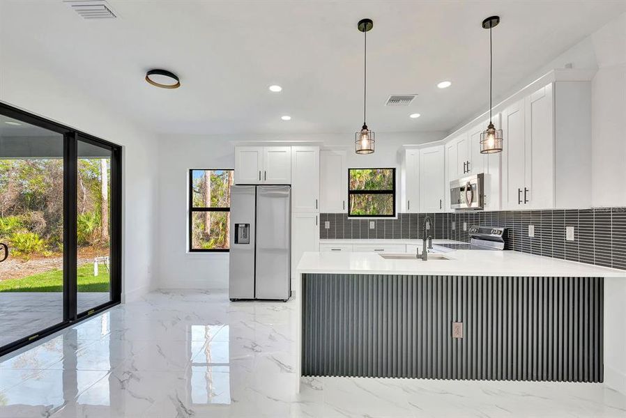 Furnished interior view inside a new home in , Port Charlotte (Image 6). Furnished interior view inside a new home in , Port Charlotte (Image 6).