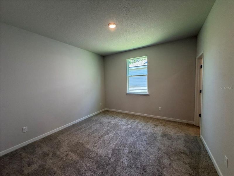 Spacious, unfurnished interior of a new home in Reserve East, Flagler Beach (Image 29).