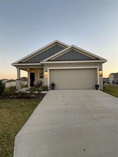 Front exterior of a new home in Peace Creek Reserve: Legacy Collection, Winter Haven, FL, highlighting curb appeal (Image 2). Front exterior of a new home in Peace Creek Reserve: Legacy Collection, Winter Haven, FL, highlighting curb appeal (Image 2).
