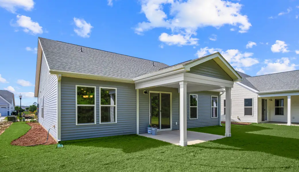 Exterior details and patio area of a home in Coastal Club of the Carolinas, Calabash (Image 3).