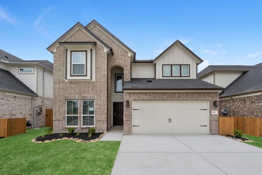 Front exterior of a new home in Grand Mason Crossing, Katy, TX, highlighting curb appeal (Image 2). Front exterior of a new home in Grand Mason Crossing, Katy, TX, highlighting curb appeal (Image 2).