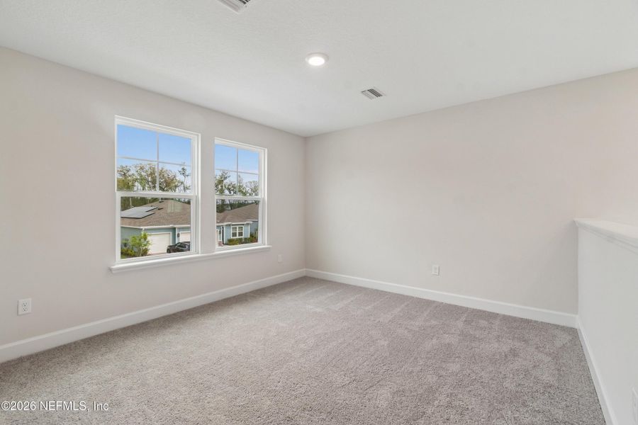 Spacious, unfurnished interior of a new home in Tributary 50', Yulee (Image 24).