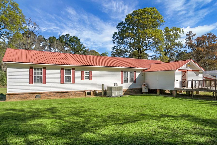 Exterior details and patio area of a home in , Bonneau (Image 34).
