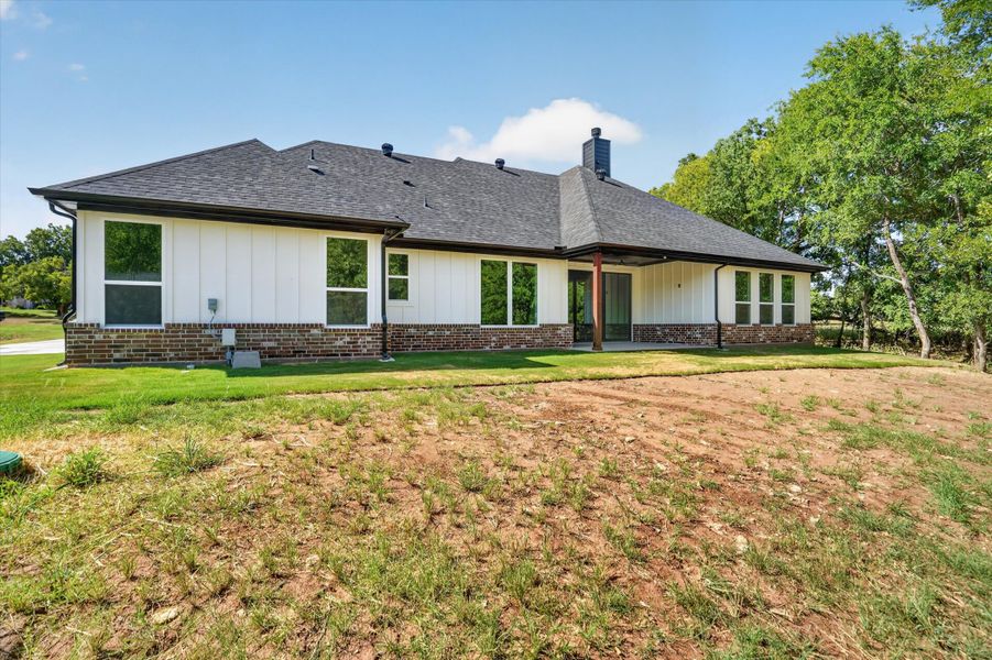 Front exterior of a new home in Cartwright Ranch, Weatherford, TX, highlighting curb appeal (Image 20). Front exterior of a new home in Cartwright Ranch, Weatherford, TX, highlighting curb appeal (Image 20).