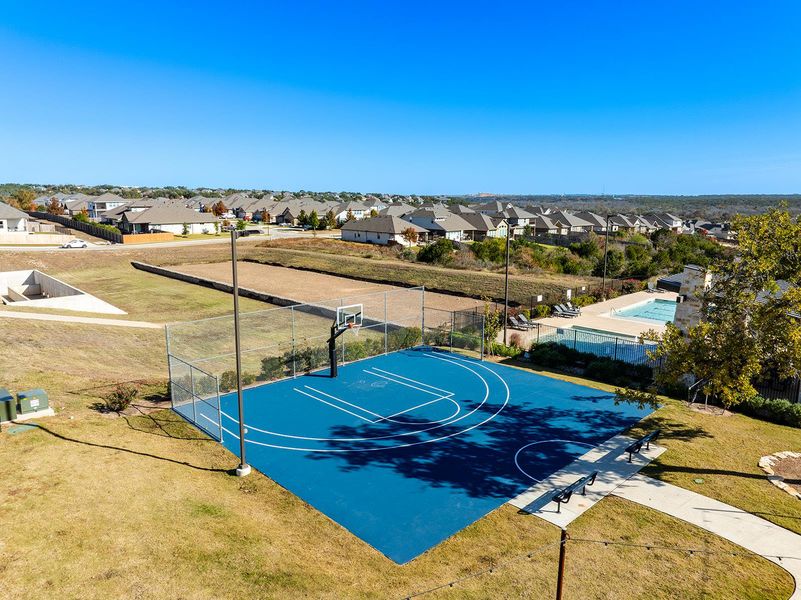 View of sport court featuring community basketball court and a residential view