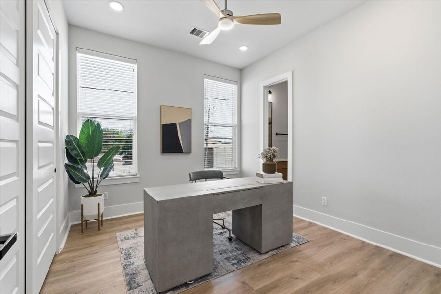 Designed with functionality in mind, this secondary space easily adapts as a bedroom or work-from-home setup Designed with functionality in mind, this secondary space easily adapts as a bedroom or work-from-home setup