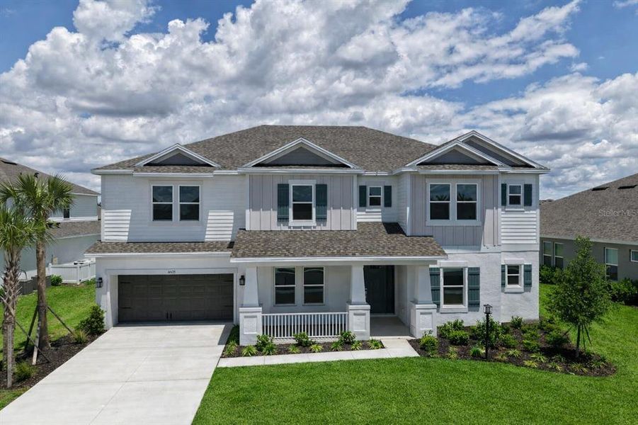 Front exterior of a new home in Park East at Azario, Bradenton, FL, highlighting curb appeal (Image 28). Front exterior of a new home in Park East at Azario, Bradenton, FL, highlighting curb appeal (Image 28).