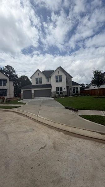 Front exterior of a new home in Clopton Farms, Montgomery, TX, highlighting curb appeal (Image 1). Front exterior of a new home in Clopton Farms, Montgomery, TX, highlighting curb appeal (Image 1).