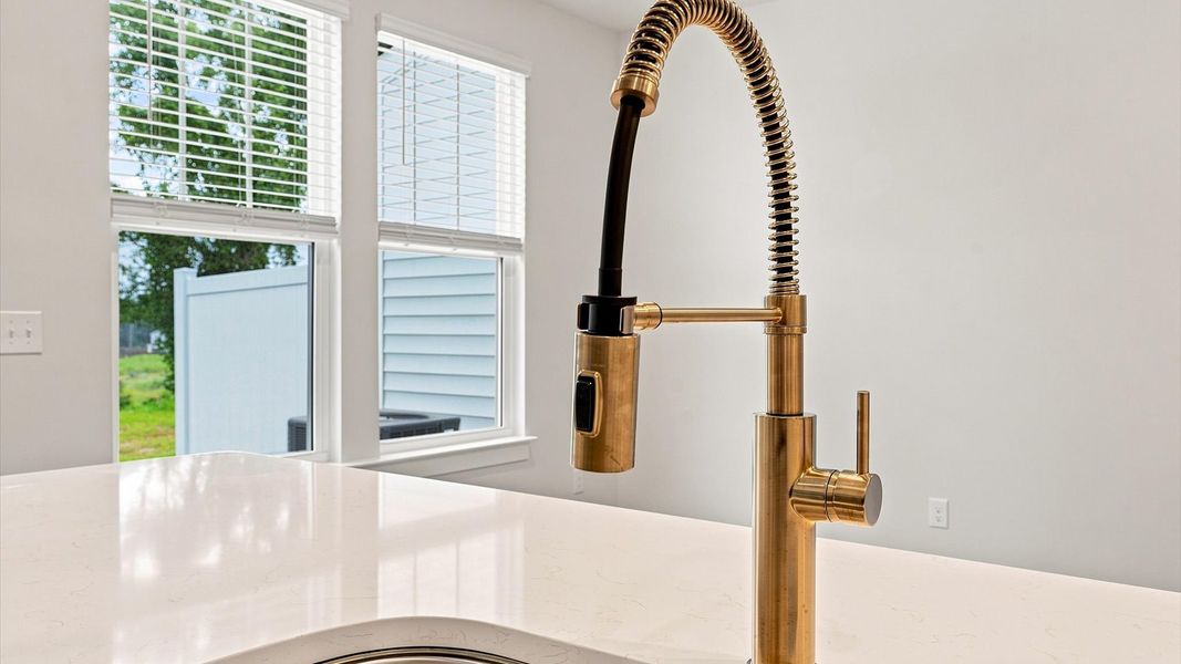 Bright and welcoming kitchen with carefully selected finishes and quartz countertops at Ransdell Pointe Bright and welcoming kitchen with carefully selected finishes and quartz countertops at Ransdell Pointe