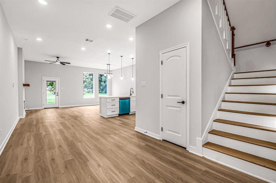 Enter to an open floor plan with easy care wood look vinyl flooring throughout the living space.