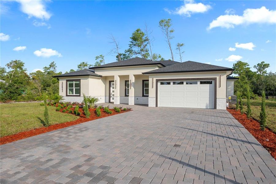Front exterior of a new home in , Eustis, FL, highlighting curb appeal (Image 24). Front exterior of a new home in , Eustis, FL, highlighting curb appeal (Image 24).