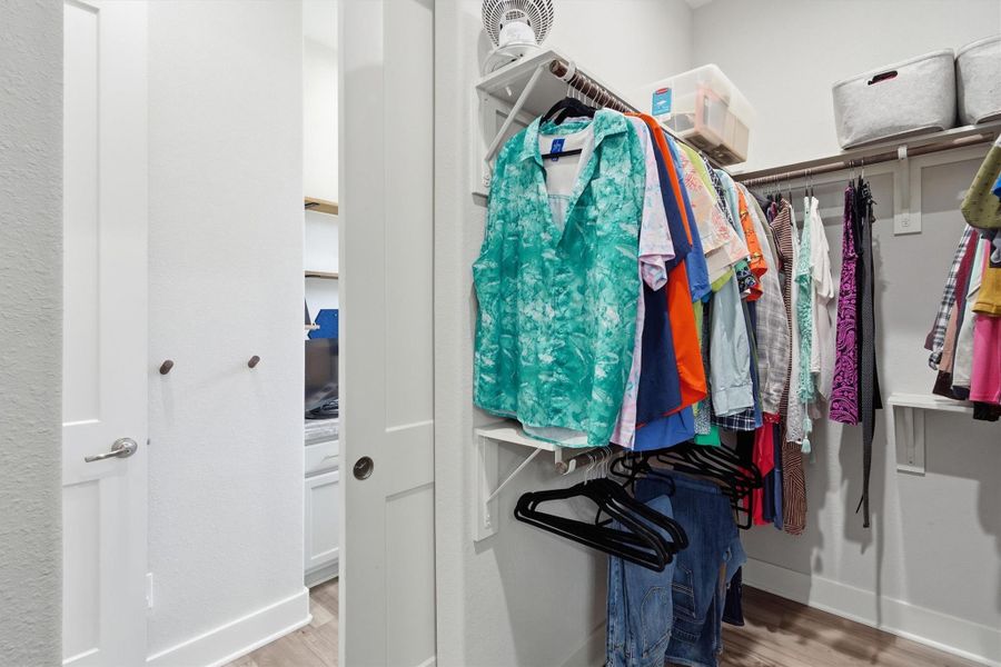 Primary walk in closet with easy access to the study/office, hallway and laundry room Primary walk in closet with easy access to the study/office, hallway and laundry room