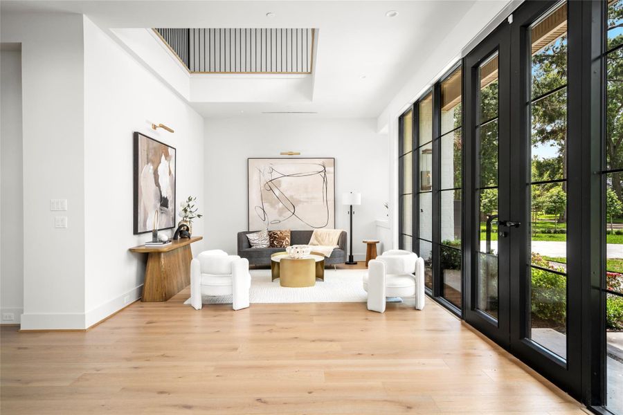Beautiful sitting room flooded with natural light and modern finishes.
