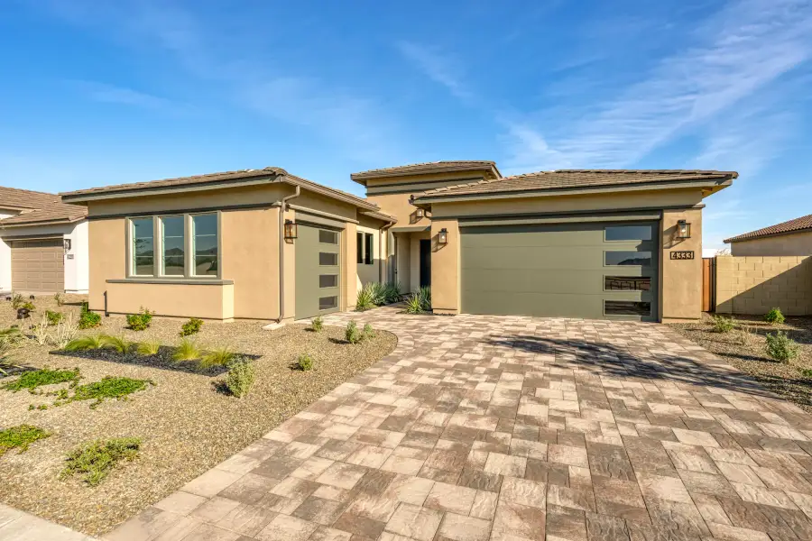 Front exterior of a new home in Abel Ranch, Goodyear, AZ, highlighting curb appeal (Image 2). Front exterior of a new home in Abel Ranch, Goodyear, AZ, highlighting curb appeal (Image 2).