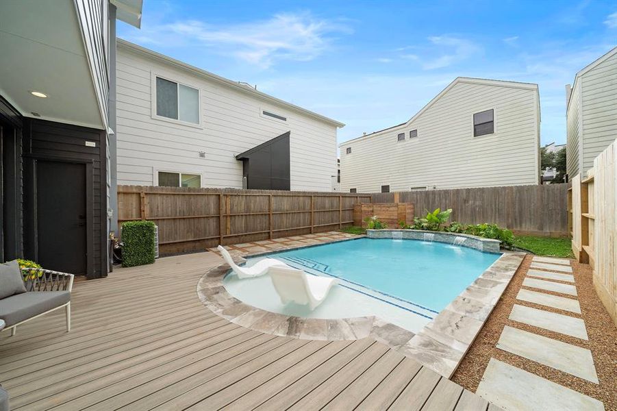 This stunning pool offers crystal-clear water and stylish landscaping, creating a perfect space for relaxation and outdoor entertaining