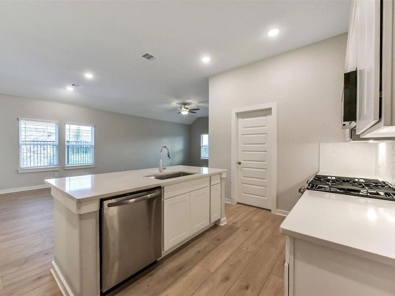 Furnished interior view inside a new home in Sunterra, Katy (Image 11).