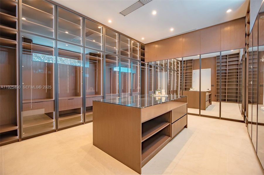 Primary Boutique-style closet Primary Boutique-style closet