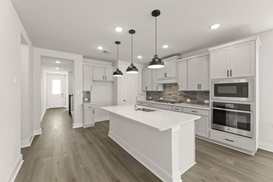 Representative furnished interior of a home built from the Willow by Tri Pointe Homes in Treeline, Justin (Image 7).