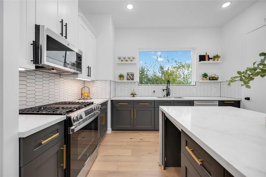 Contemporary, open concept kitchen with high-end finishes