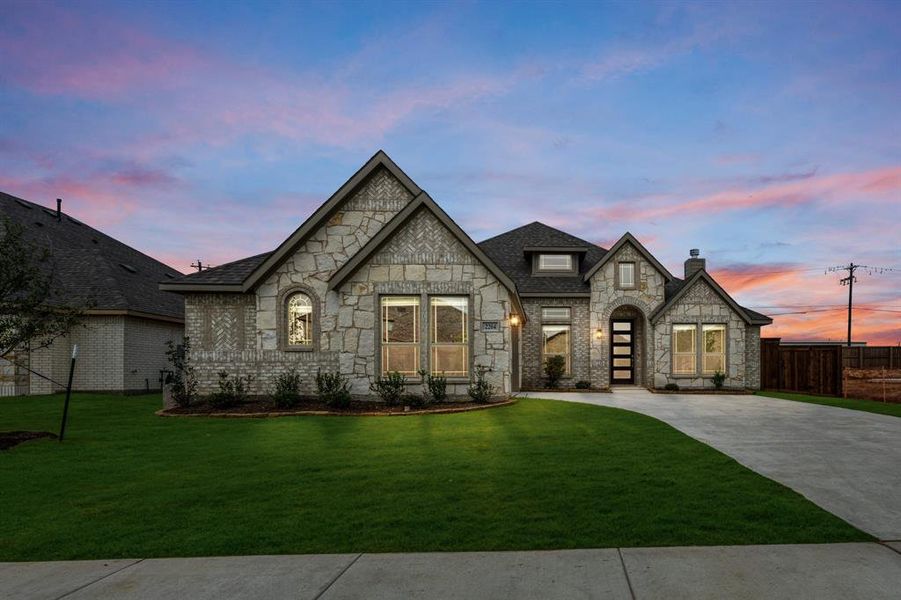 Front exterior of a new home in Somerset, Venus, TX, highlighting curb appeal (Image 2).