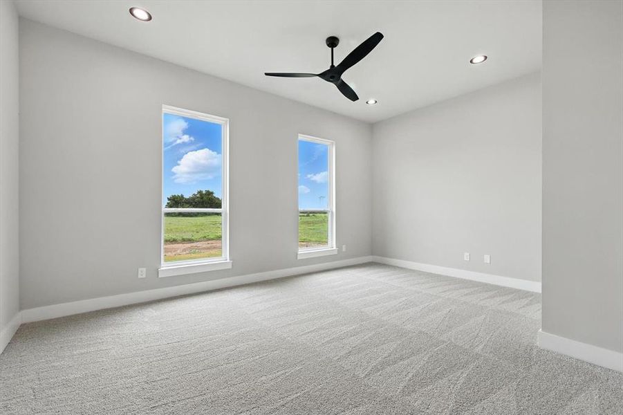 Carpeted spare room featuring recessed lighting and ceiling fan Carpeted spare room featuring recessed lighting and ceiling fan